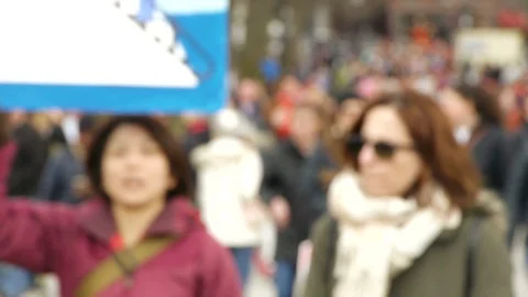 Soft Focus Slow Motion Marchers Holding Signs and Walking Video stock 87661648