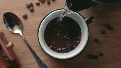 Soft focus slow motion on top view a hot water pouring into a cup from a teapot Stock Footage 247269910