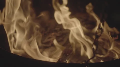 Soft focus Slowmotion shot of a fire and flames burning away a newspaper in a Stock Footage 304152055