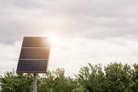 Soft focus on small solar panel in sunset, sun energy and clean environment Stock Photos