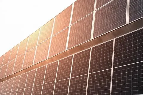 Soft focus on solar panels in sunset, sun energy and clean environment Stock Photos
