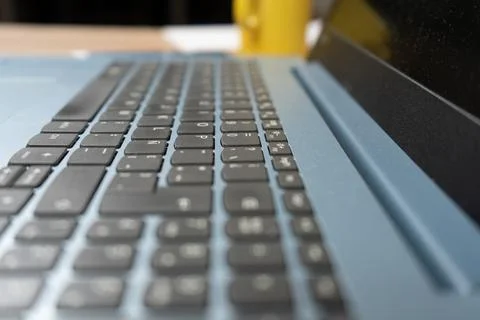 Soft focus of a Spanish version laptop keyboard. Technology concept, homeoffi Stock Photos