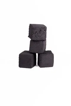 Soft focus. A stack of charcoal cubes for a hookah on a white background. clo 스톡 사진