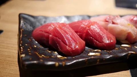 Soft focus sushi closeup / Salmon Tuna Hamaji and Squid Stock Footage 79843106