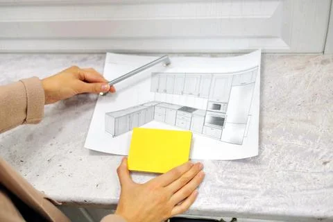 Soft focus On the table is a mock-up of a kitchen, an example of a palette of Stock Photos