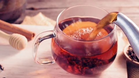 Soft focus teacup Pour hot tea into a cup with hot steam or smoke.  Stock Footage 202195089