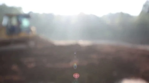 Soft Focus Title Card Screen of Mini Dozer with Light Flare from Sunrise 库存影片 69247475