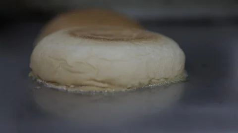 Soft Focus of Toasting Bread for a Hamburger Stock Footage 128760523