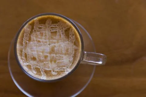 Soft focus Top view close up of ice latte coffee in a white ceramic cup on a  Stock Photos
