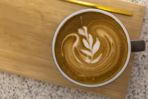 Soft focus Top view close up of hot espresso, latte coffee in a red ceramic c 스톡 사진