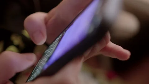 Soft focus using the message keyboard on your phone to type a sentence Two hands Stock Footage 295932259