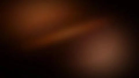 Soft focus warm brown and orange bokeh lights creating a cozy and inviting .. 動画素材 336365208