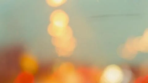 Soft focus warm lights abstract background with subtle blue green hues Stock Photos