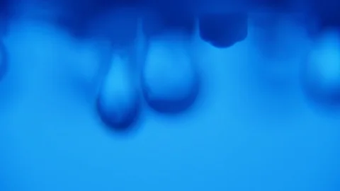 Soft focus water droplets fall from a shower nozzle in a blue bathroom Stock Footage 87646430