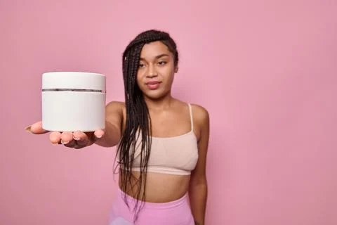 Soft focus on a white container, jar with cosmetic product in the outstretche Foto stock