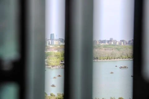 Soft focus window bars with lake beyond in Beijing Stock Photos