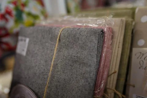 Soft focused close up shot of several table clothes in plastic packages Stock Photos