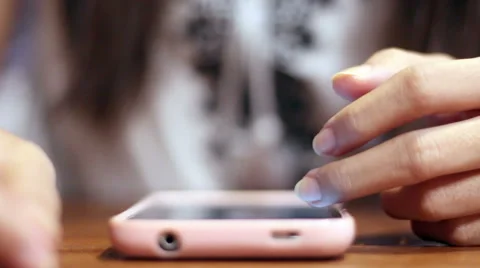 Soft focused girl's hands browsing smartphone Stock Footage 61188040