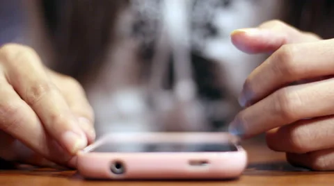 Soft focused girl's hands browsing smartphone Stock Footage 61188537