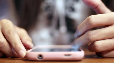 Soft focused girl's hands browsing smartphone Stock Footage 61188765