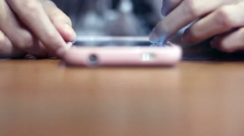 Soft focused girl's hands browsing smartphone Stock Footage 61189438