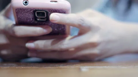 Soft focused girl's hands browsing and texting smartphone Stock Footage 61190602
