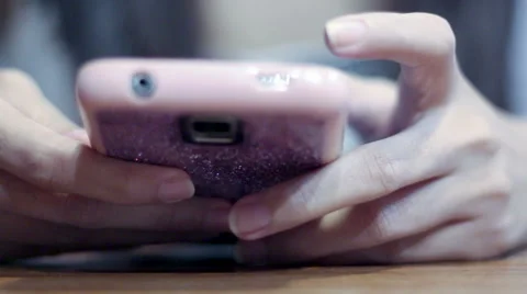 Soft focused girl's hands browsing smartphone Stock Footage 61191931