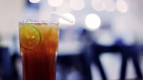 Soft focused Iced tea with lime slice and restaurant background Stock Footage 66693028