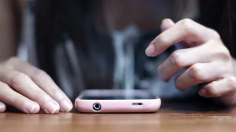 Soft focused young girl browsing smartphone Stock Footage 61186580