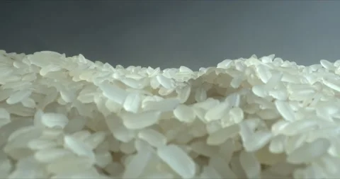 Soft fog on dark background with White rice grains close-up. Food background Stock Footage 143377373