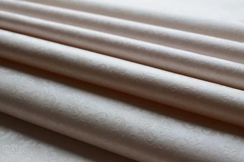 Soft folds of a patterned tablecloth Stock Photos