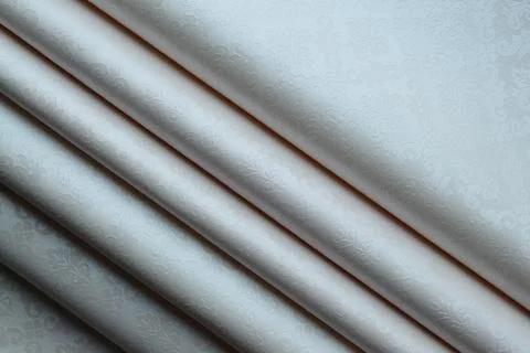 Soft folds of a patterned tablecloth Stock Photos
