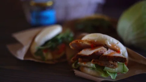 A soft fresh rice bun is steamed. Japanese fast food. Bao burger. Chef cooking Stock Footage 79347693