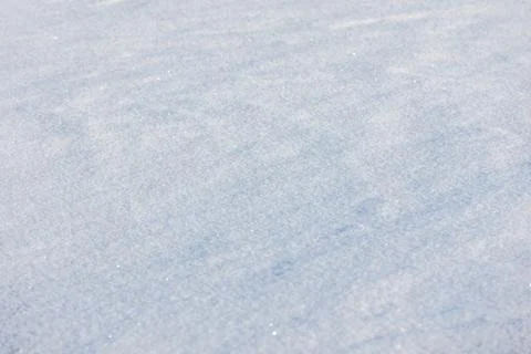 Soft fresh snow covers a flat winter surface, creating a minimal textured b.. Stock Photos