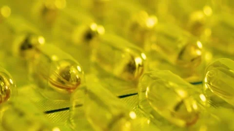 Soft gel capsule in blister pack slow motion macro photography Stock-Footage 341970202