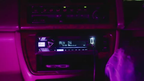 Soft glow vehicle audio setup, Evening car dashboard with illuminated controls 스톡 동영상 324952636
