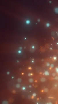 Soft glowing bokeh particles floating across a warm gradient background with  Stock Illustration