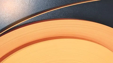 Soft glowing light source at top left corner. Concentric orange and yellow ri Stock Photos