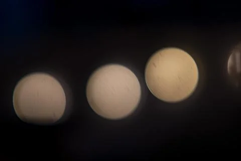 Soft glowing lights create a mysterious atmosphere in a dimly lit room at night Stock Photos