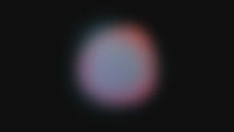 A soft glowing orb of red and blue light centered against a dark background Stock Footage 339617819
