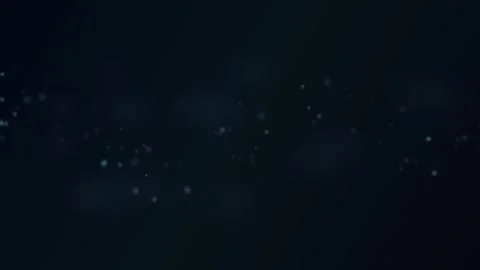 Soft glowing particles drifting across dark blue background Stock Footage 335883935