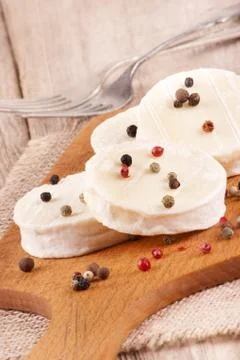 Soft goat cheese with pepper Stock Photos