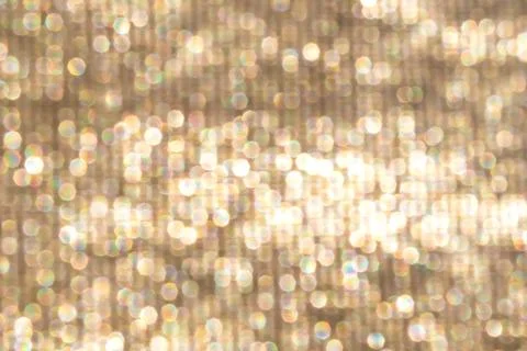 Soft gold bokeh background with glitter sparkles and warm light abstract texture Stock Photos