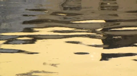 Soft gold lazy reflections in calm water Stock Footage 38351531