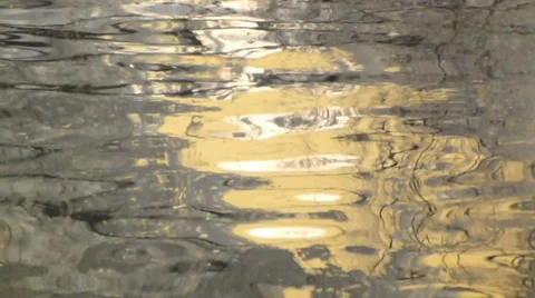 Soft gold lazy reflections in calm water Stock Footage 38503448