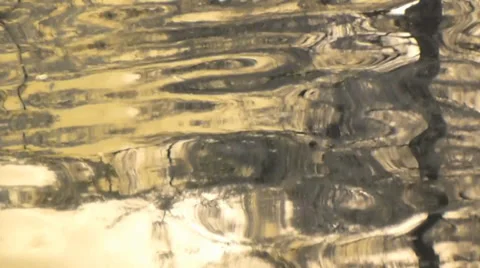 Soft gold lazy reflections in calm water Stock Footage 38513101