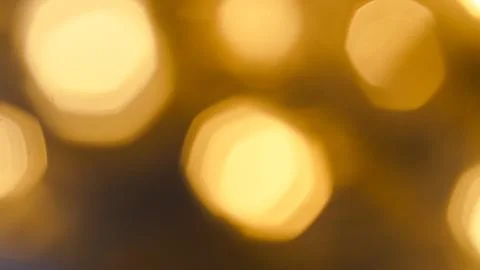 Soft golden bokeh lights create a festive and warm holiday atmosphere Stock Photos