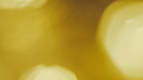 Soft golden light blurred into warm bokeh circles for a festive holiday mood Stock Illustration