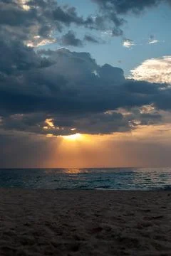 Soft golden light illuminates an empty sandy beach and the calm Black Sea Foto stock