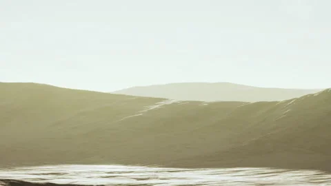 Soft Golden Light Illuminates Rolling Hills Above a Reflective Water Surface Stock Footage 348247809